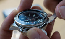 Load image into Gallery viewer, Using a watch case knife to change the bezel of a dive watch